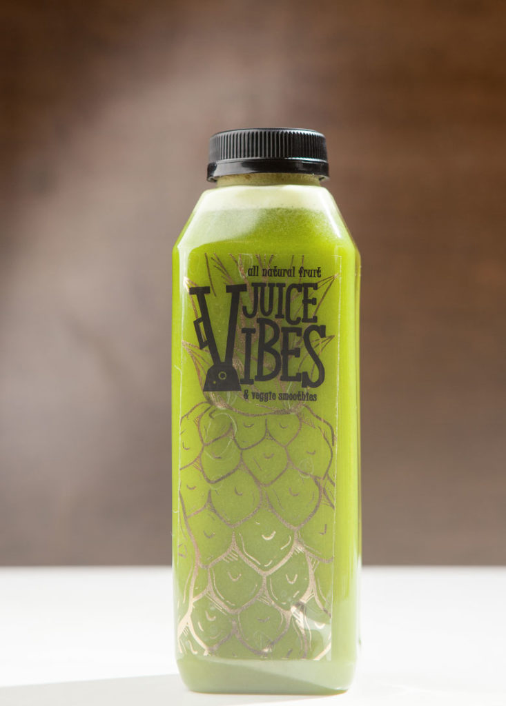 Bottle of green juice for a juice cleanse